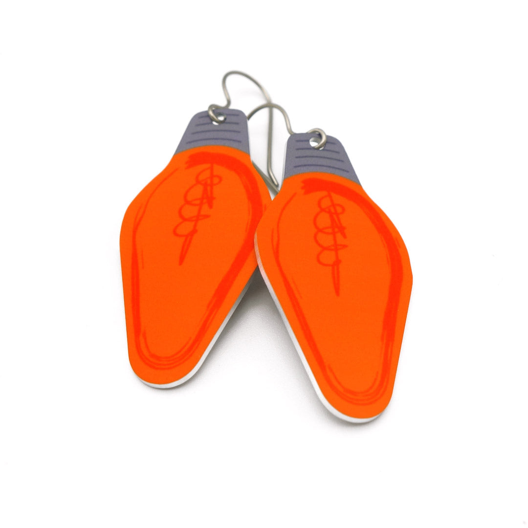 A pair of orange Christmas light bulb earrings by ColorUpLife.