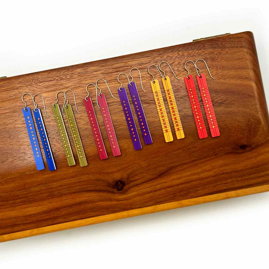 Color weave bar earrings displayed in six bold colors: blue, olive green, cranberry, purple, yellow, and red by ColorUpLife.