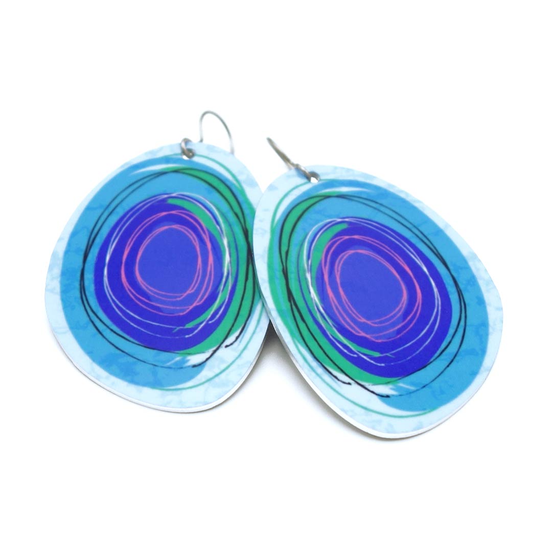 Large solid oval-shaped hoop earrings with light blue graphics by ColorUpLife.