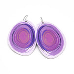 Large solid oval-shaped hoop earrings with light purple graphics by ColorUpLife.