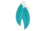 A pair of long turquoise leaf earrings by ColorUpLife.