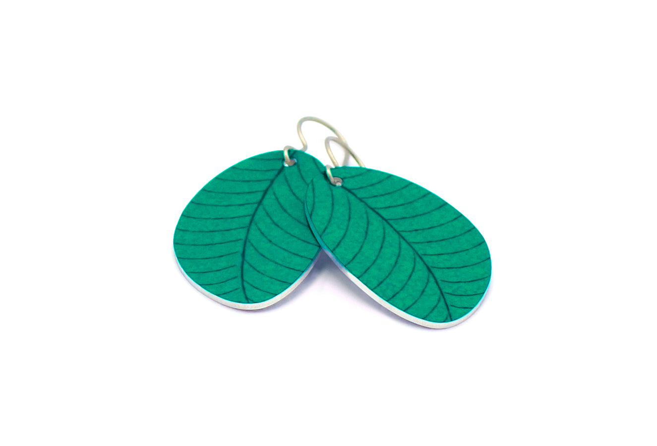 A pair of small leaf earrings in teal by ColorUpLife.