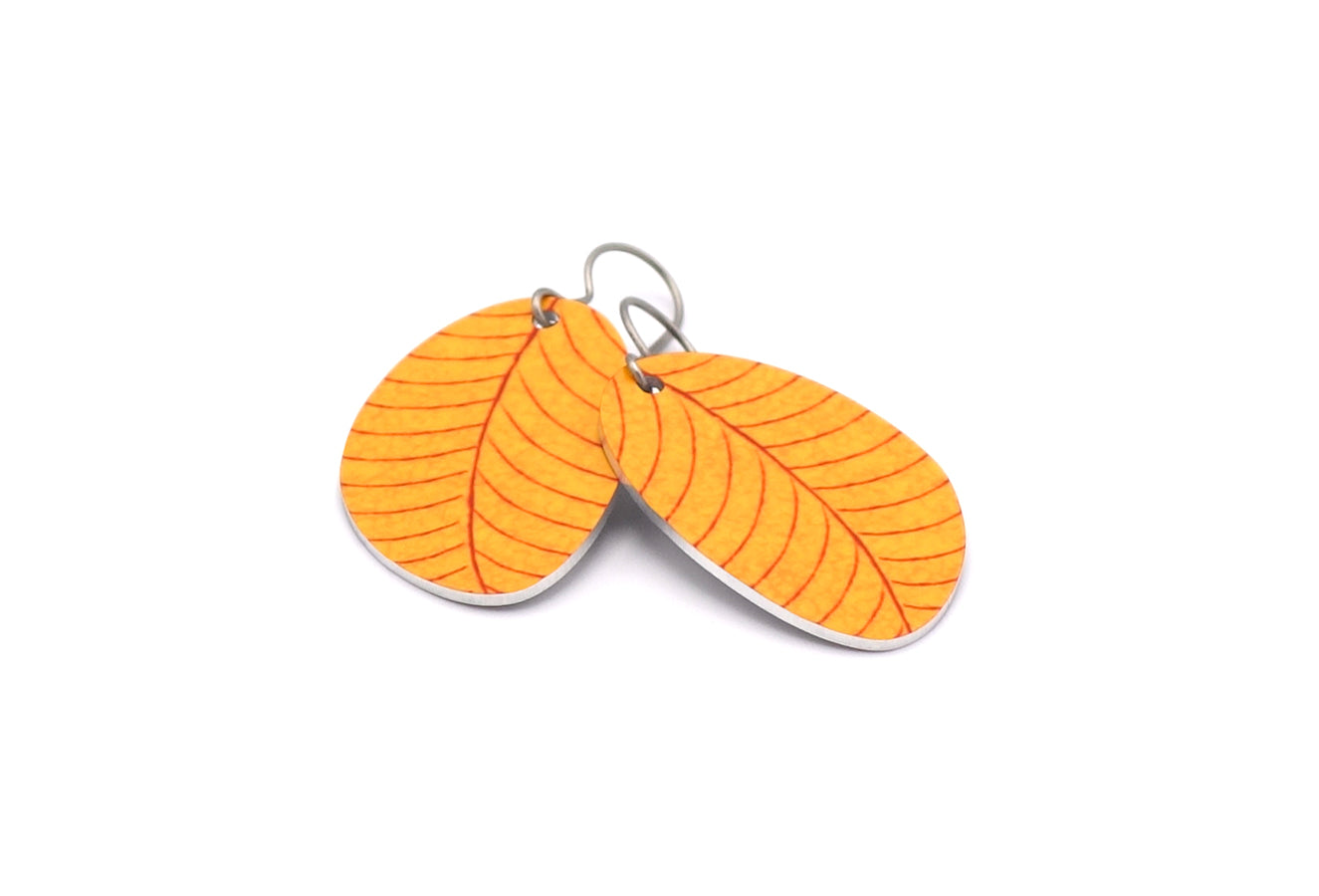 A pair of small leaf earrings in yellow by ColorUpLife.